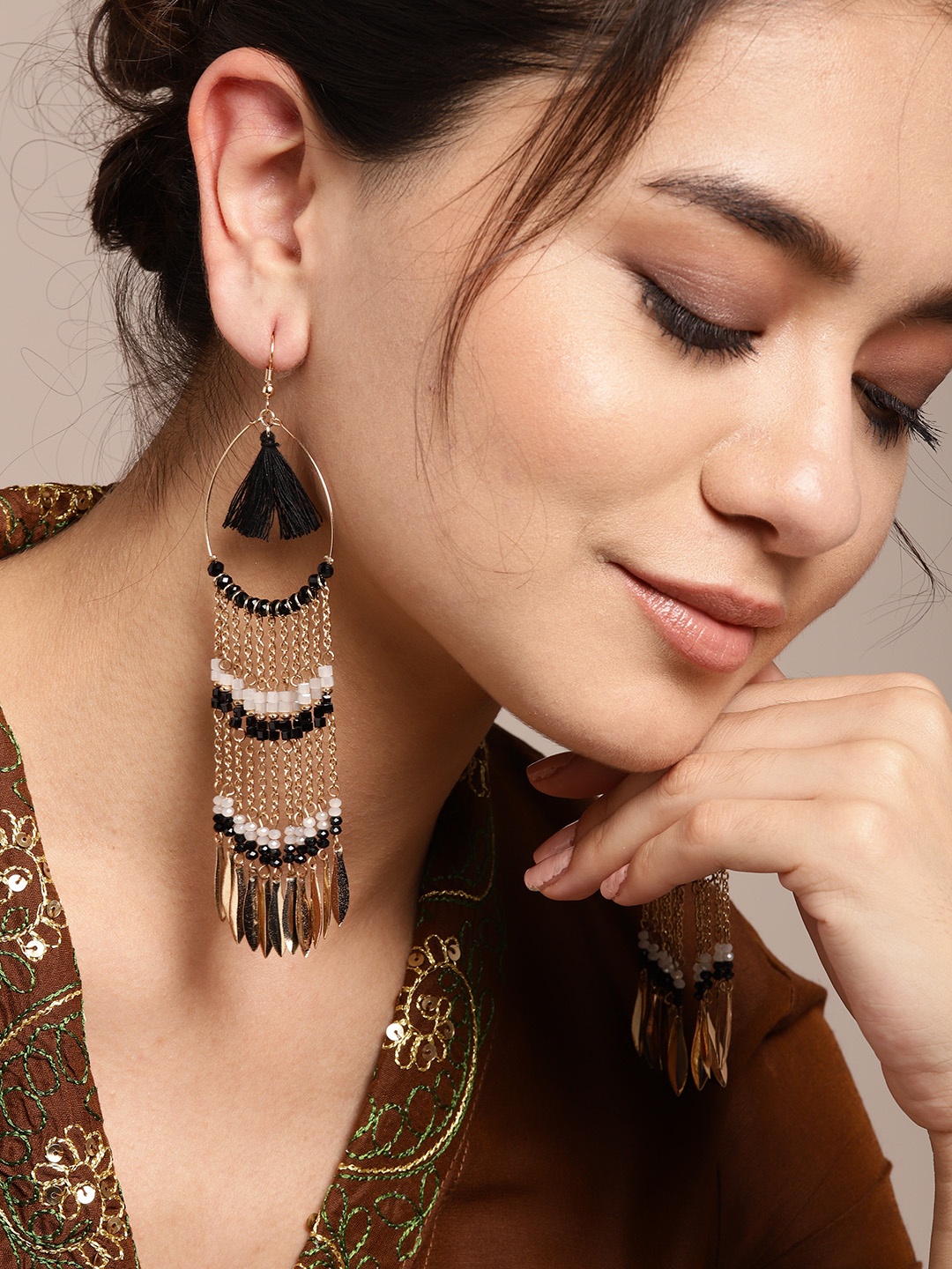 

Sangria Gold-Toned & Black Beaded Taselled Teardrop Shaped Drop Earrings