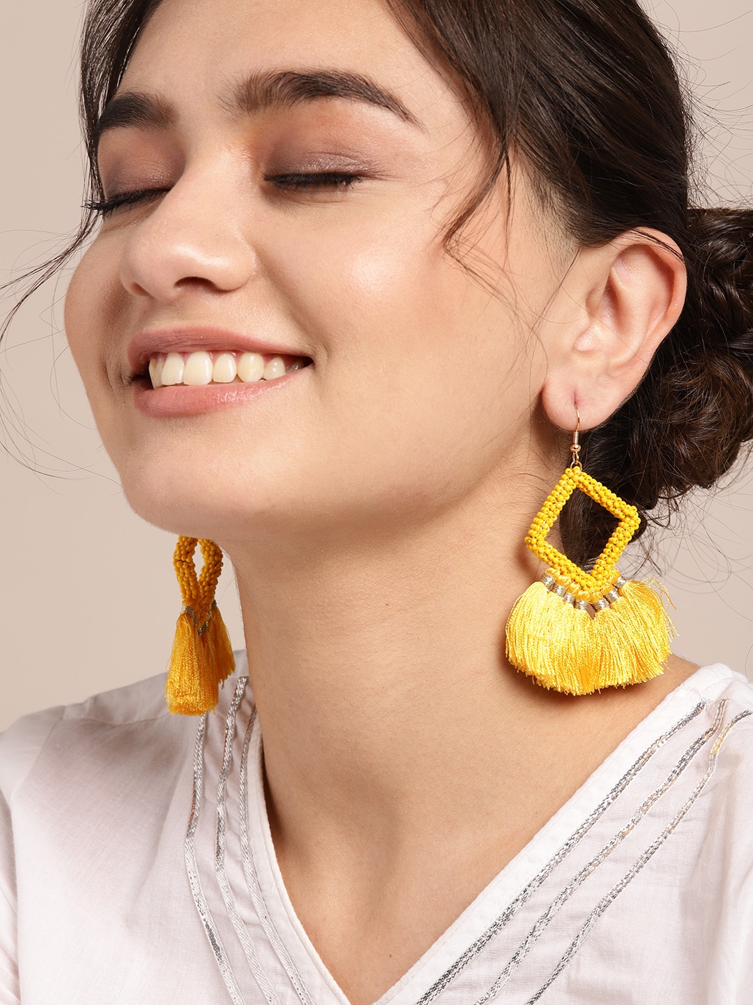

Sangria Yellow & Gold-Toned Beaded Diamond Shaped Tasseled Drop Earrings