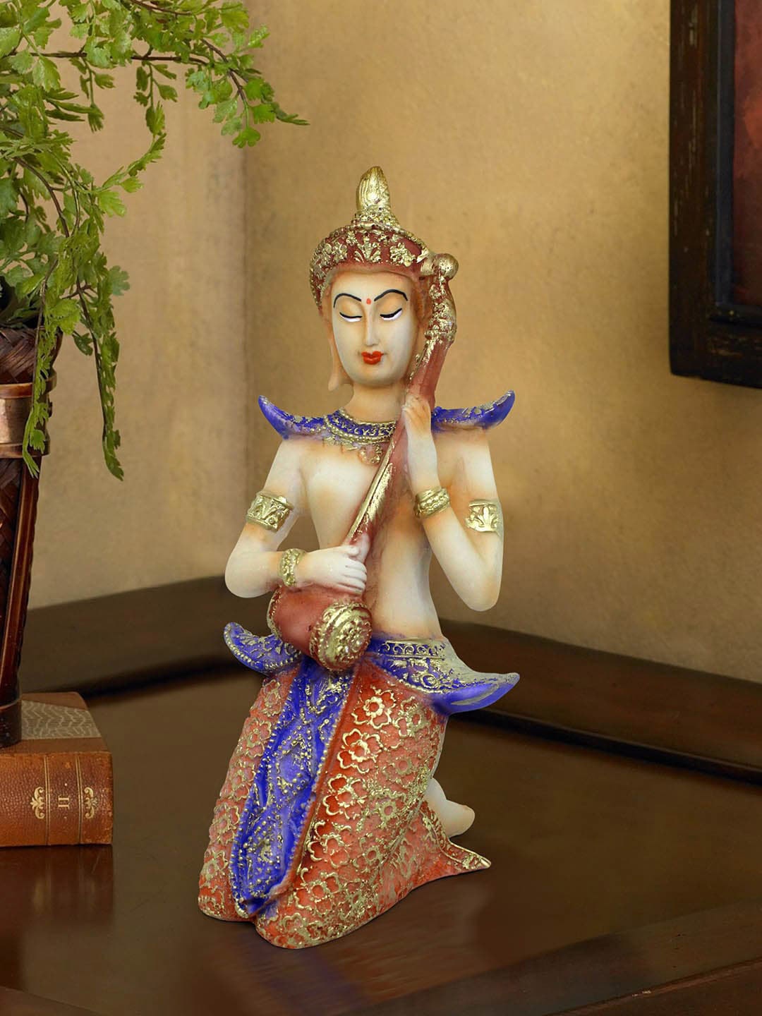 

TIED RIBBONS Orange & Blue Polyresin Decorative Divine Musical Buddha Showpiece