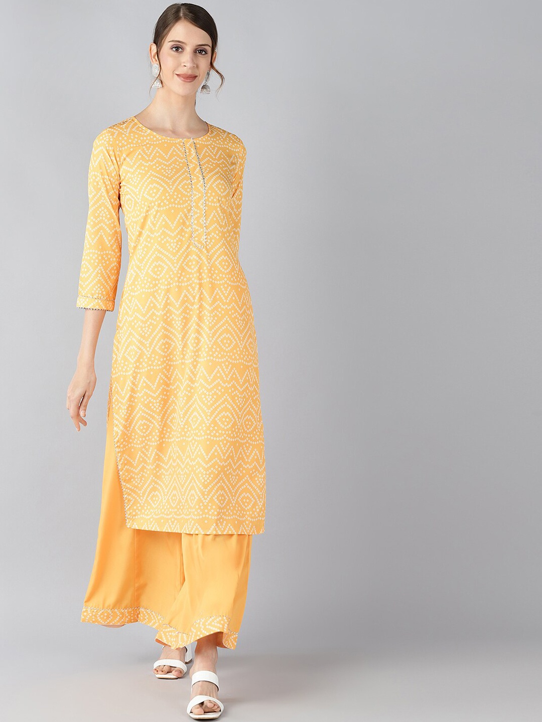 

AHIKA Women Yellow Embroidered Regular Kurti with Palazzos