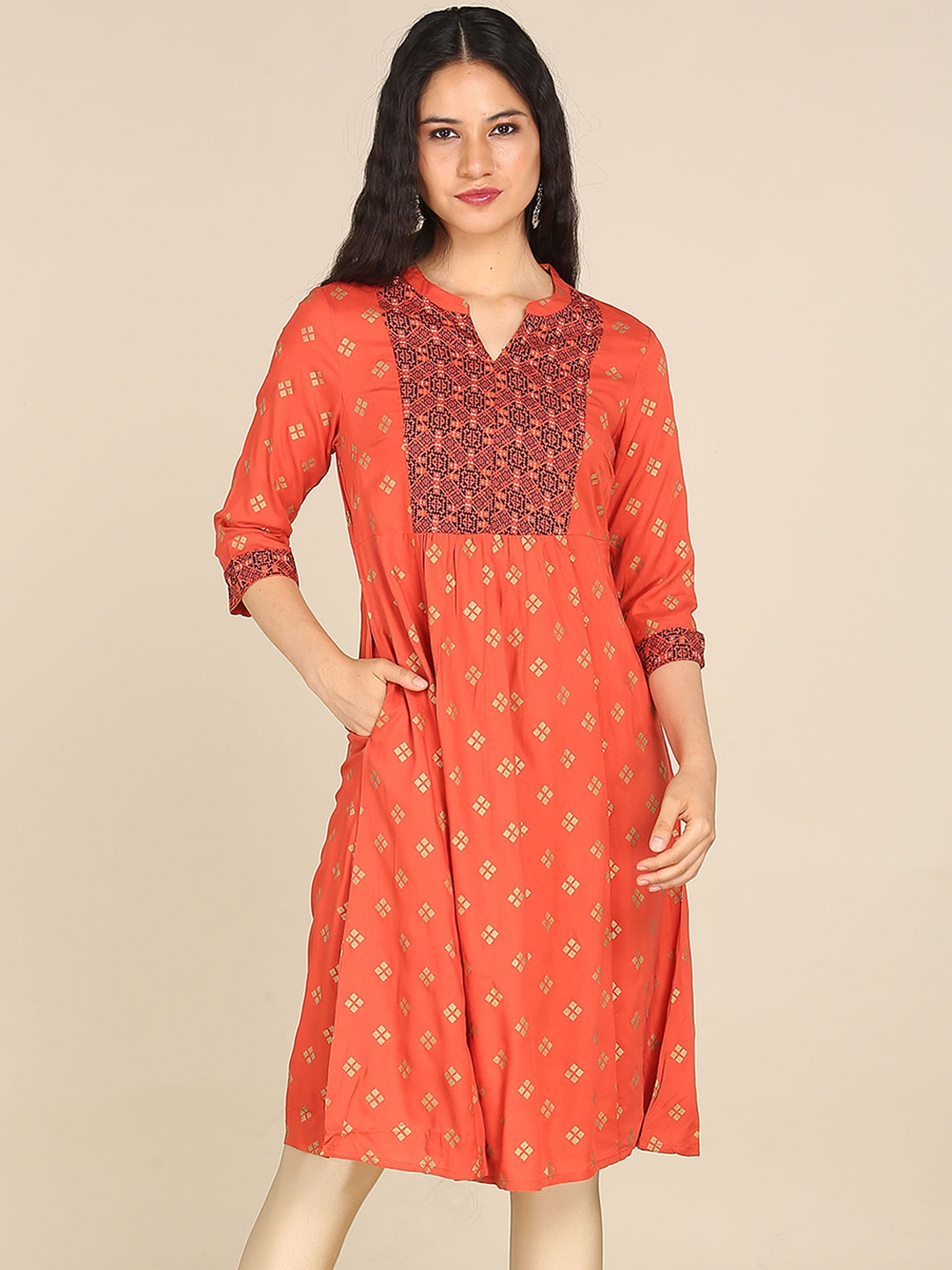 

Karigari Women Rust Geometric Embellished Kurta