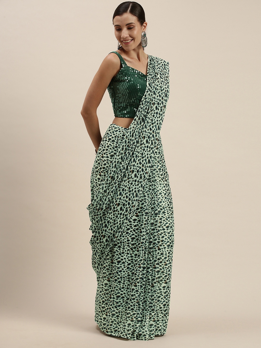 

Ethnovog Green Cream-Coloured Sequinned Saree