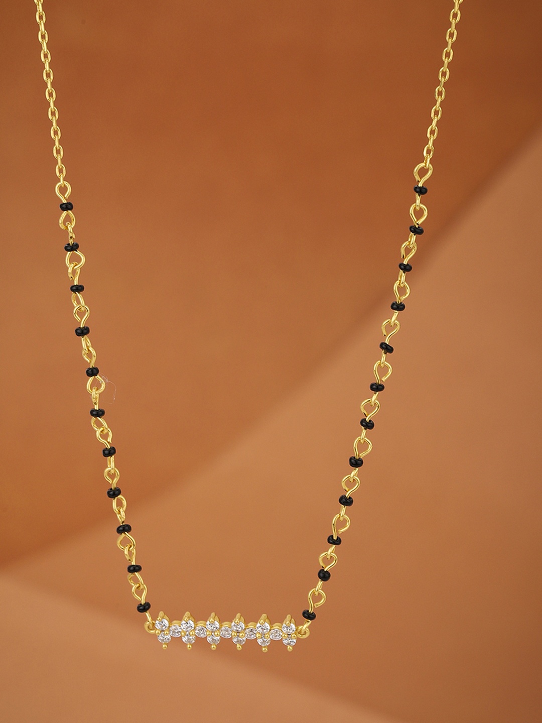 

Carlton London Women Black & Gold-Toned Artificial Stone Studded Mangalsutra
