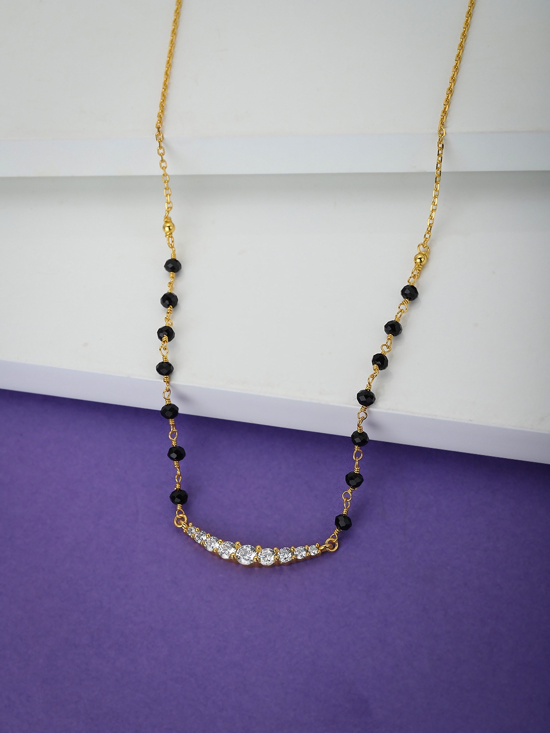 

Carlton London Women Black & Gold-Toned Artificial Stone Studded Mangalsutra