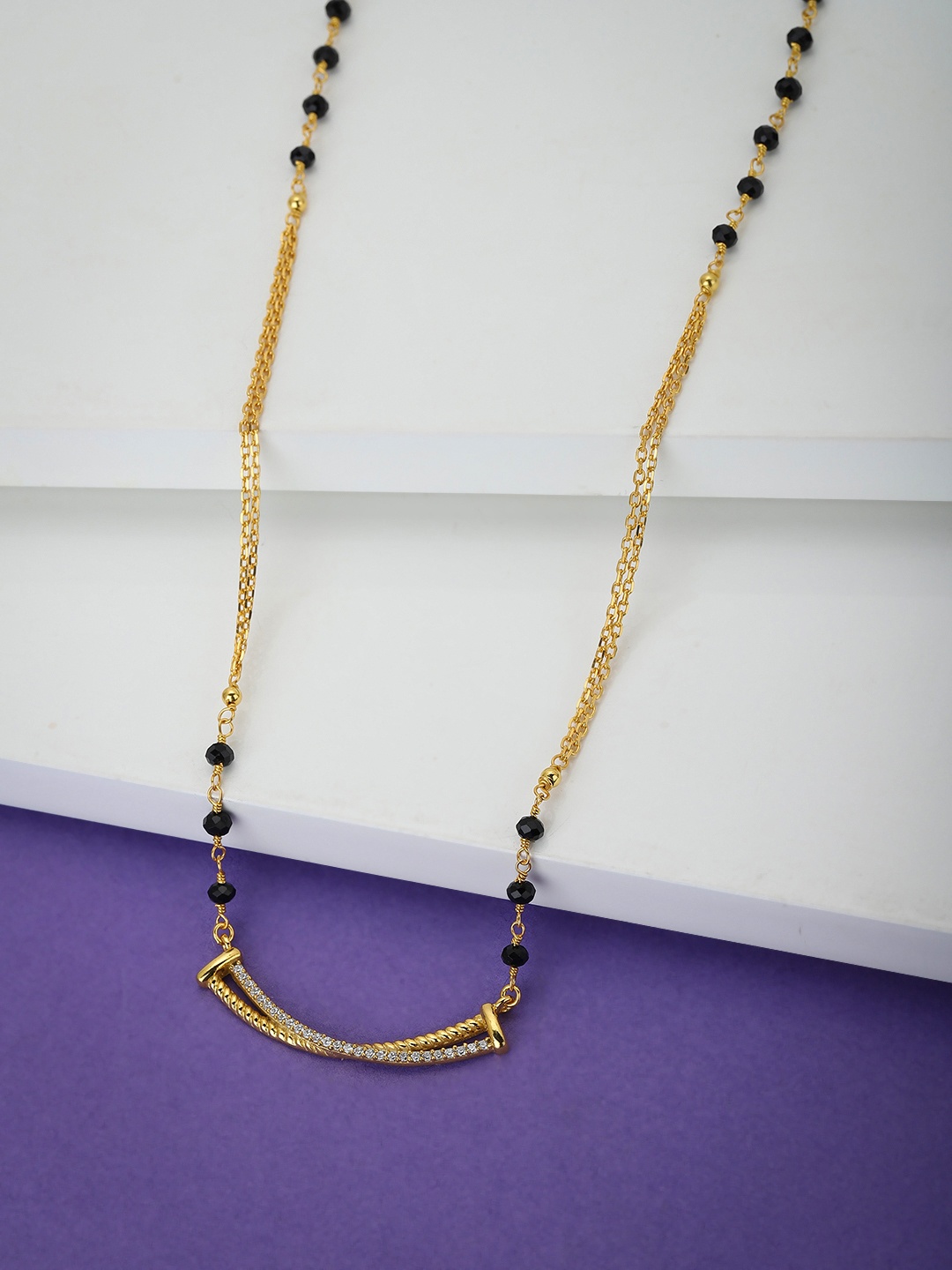 

Carlton London Women Black & Gold-Toned Artificial Stone Studded Mangalsutra