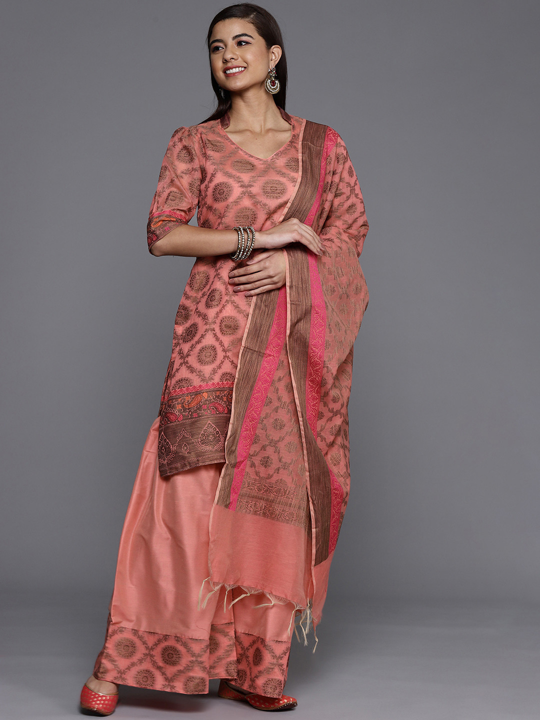 

Chhabra 555 Women Peach-Coloured Regular Kurta with Sharara & With Dupatta