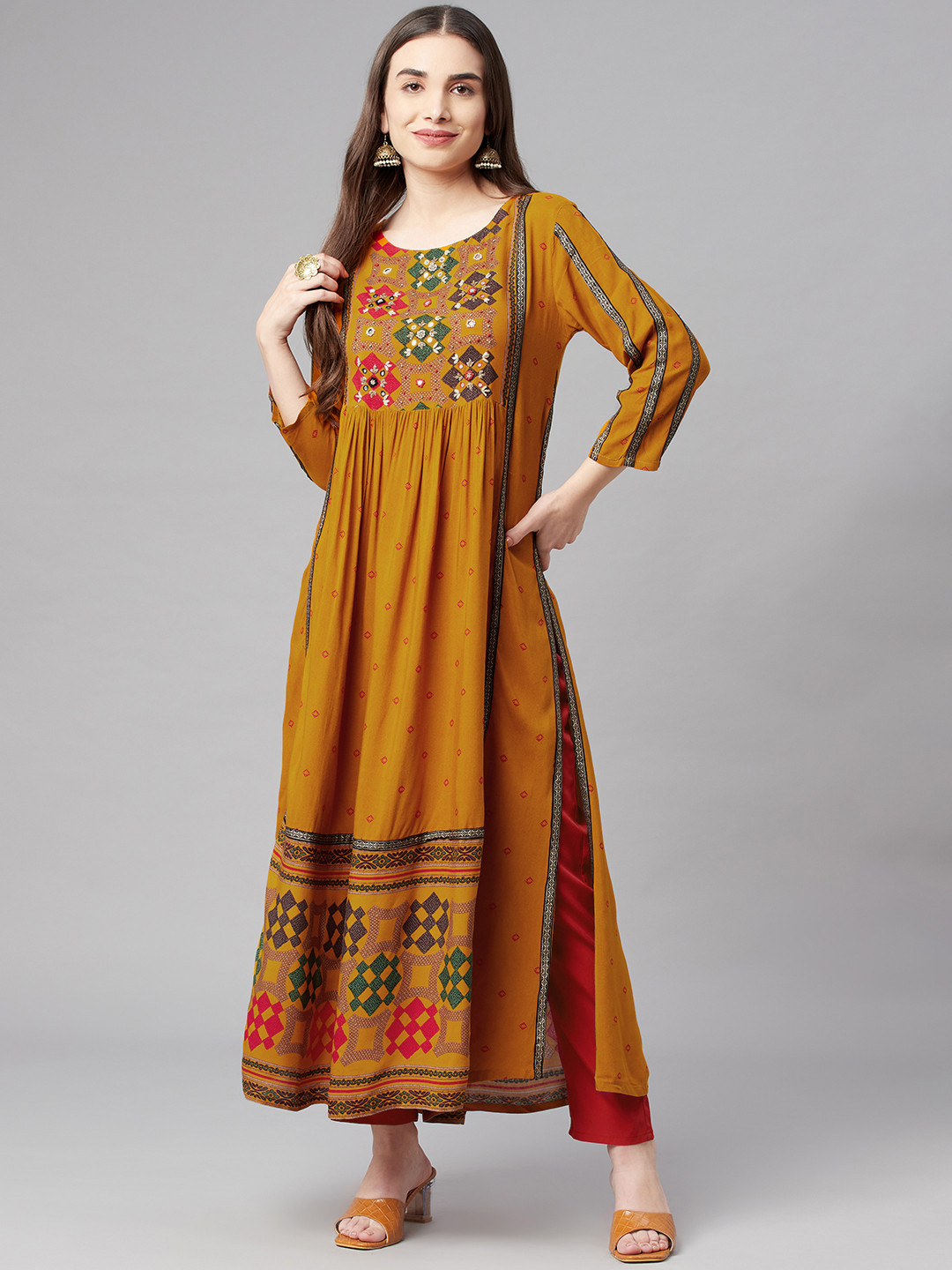 

Nehamta Women Mustard Yellow & Red Geometric Printed Thread Work Kurta