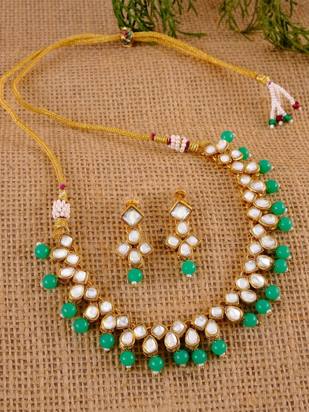 

Crunchy Fashion Gold-Plated Green & White Kundan-Studded Traditional Jewellery Set