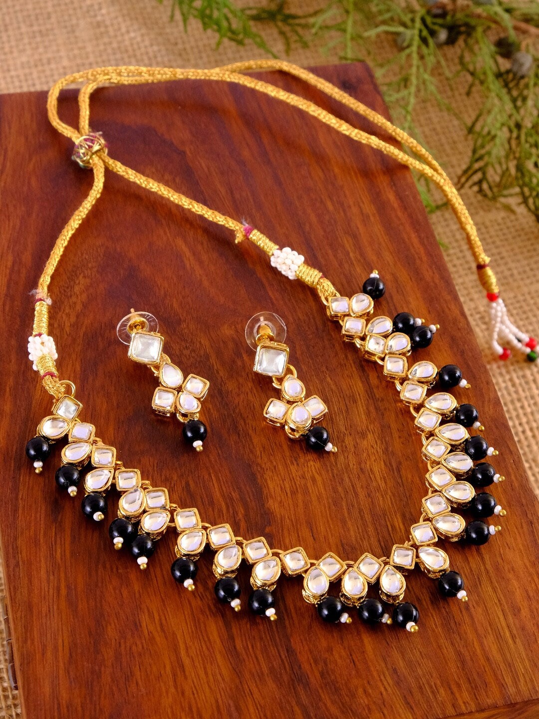 

Crunchy Fashion Gold-Plated White & Navy Blue Kundan-Studded & Beaded Antique Jewellery Set