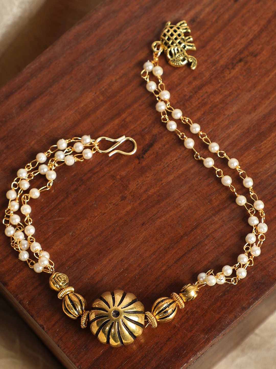 

ANIKAS CREATION Women Gold-Plated & Cream Pearls Handcrafted Charm Bracelet