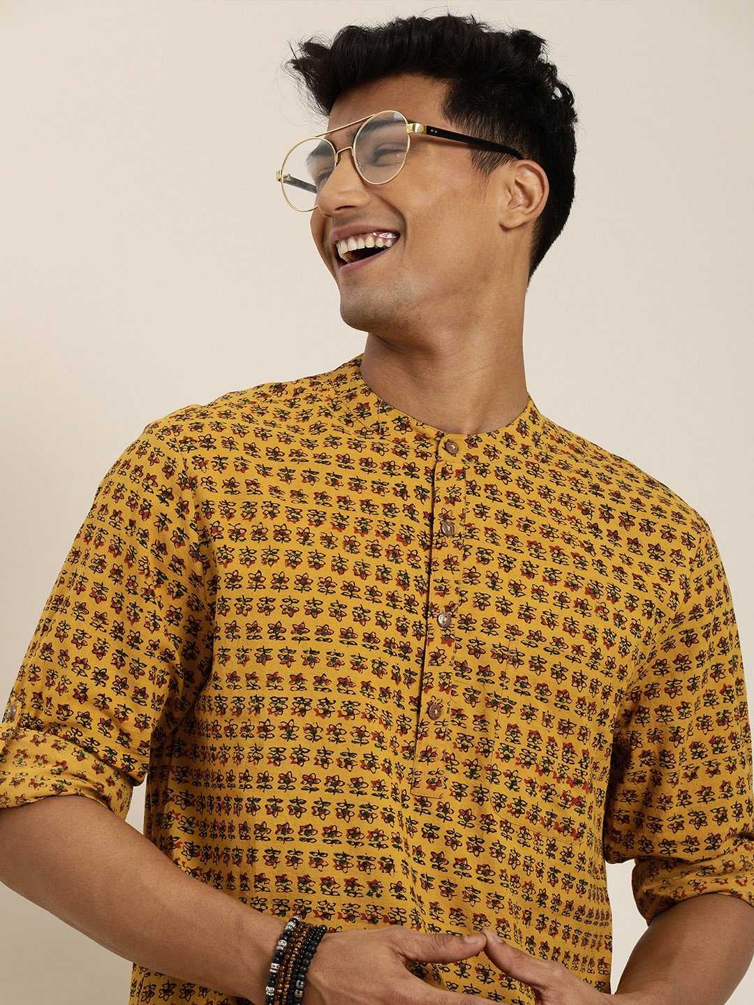 

Taavi Men Mustard Yellow & Black AJrakh Printed Susutainable Kurta