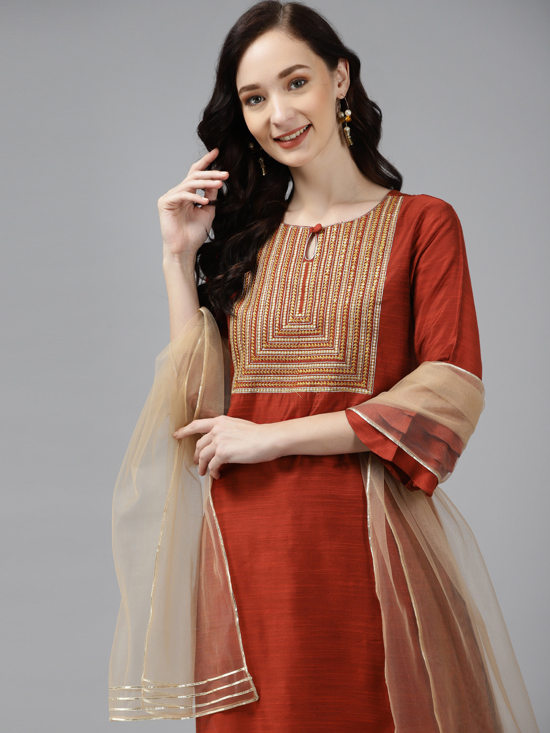 

Indo Era Women Orange Floral Embroidered Regular Chanderi Silk Kurta with Palazzos