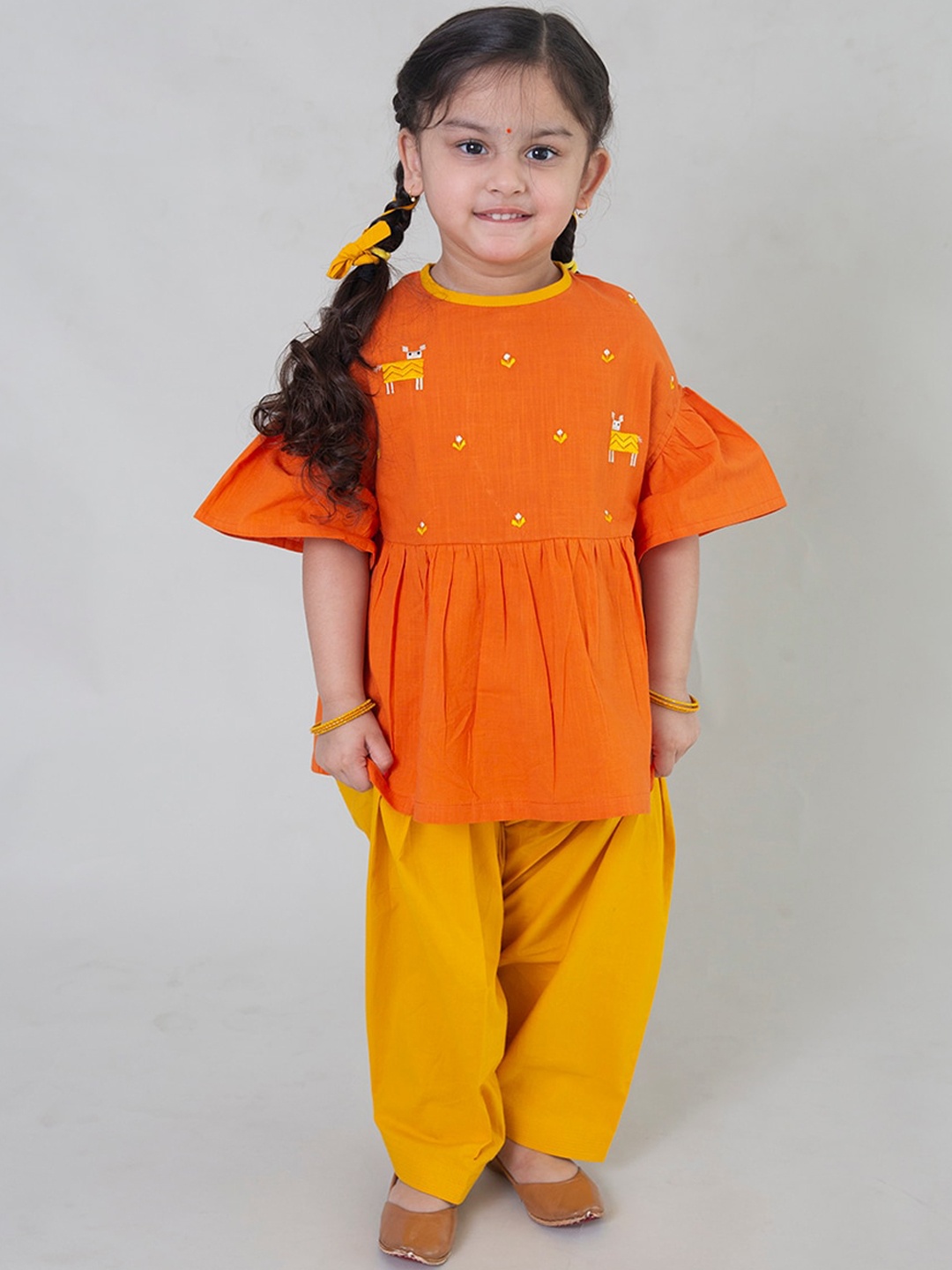 

Tiber Taber Girls Orange Embroidered Pleated Pure Cotton Kurti with Dhoti Pants
