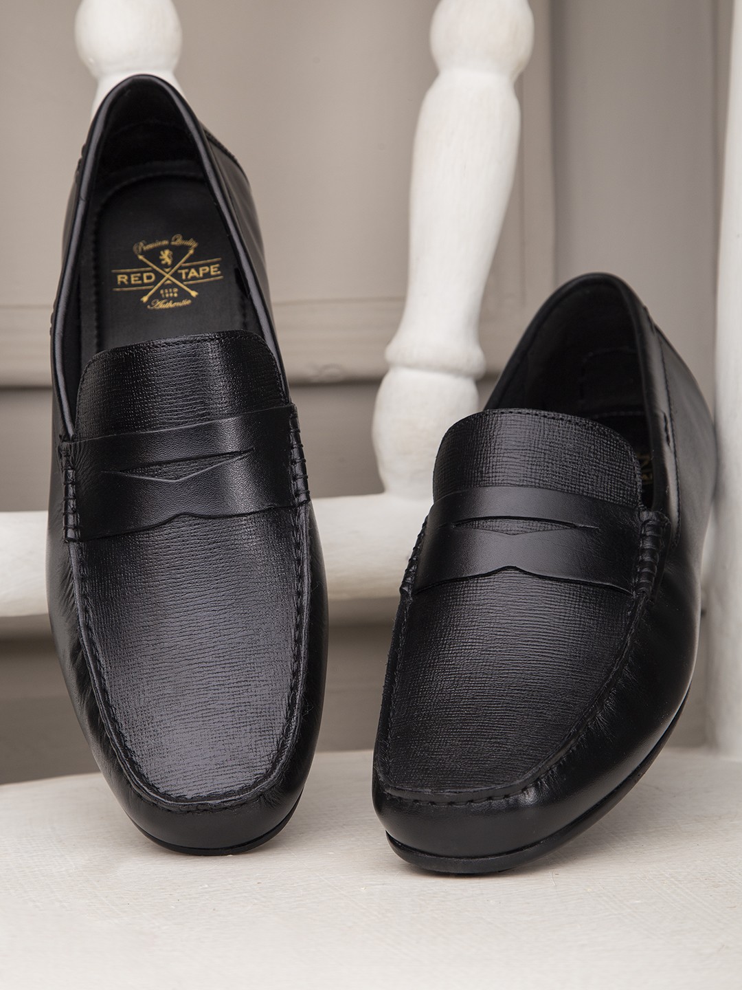 

Red Tape Men Black Solid Formal Leather Slip-On's