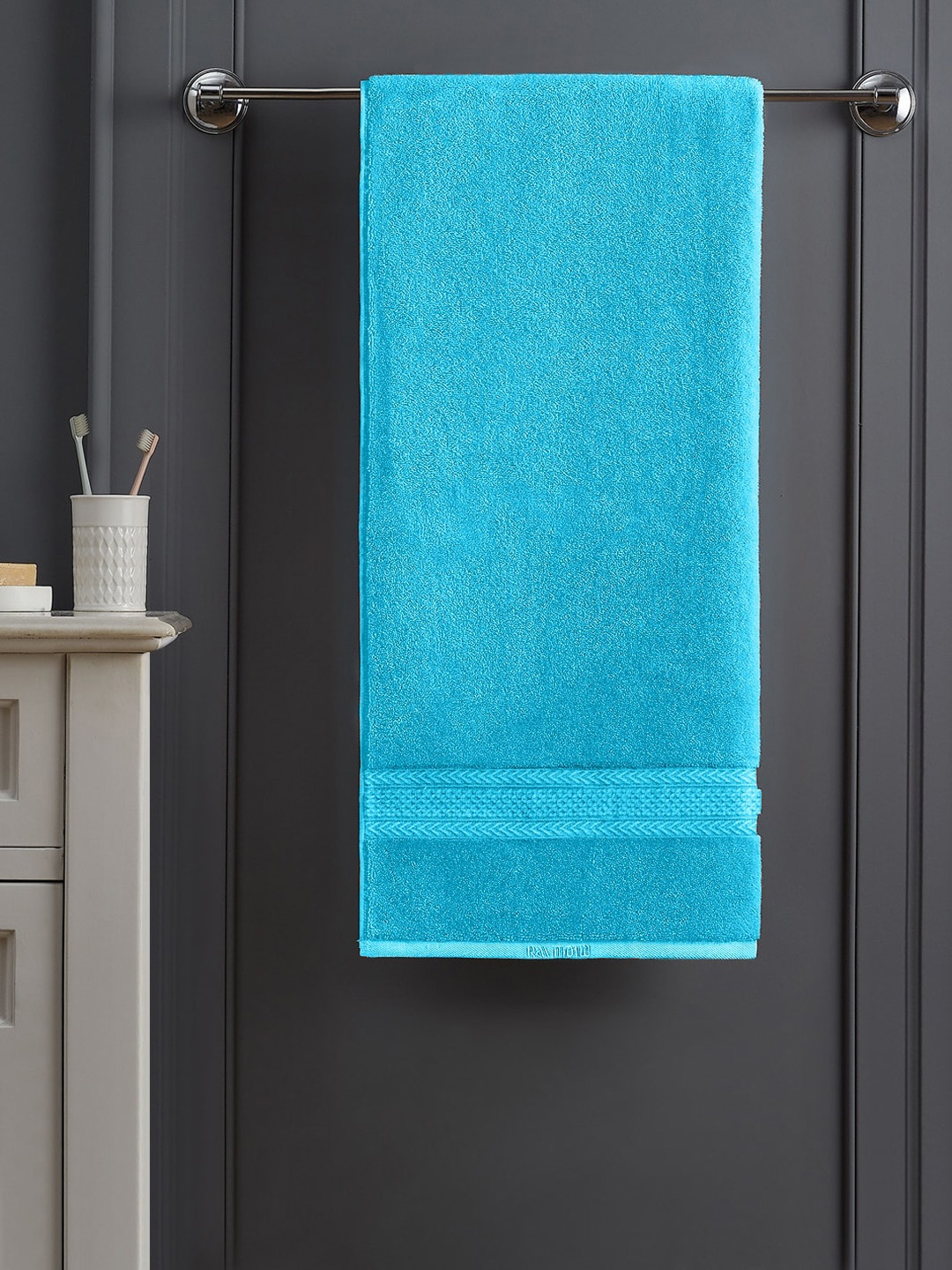 

Raymond Home Turquoise Blue Solid 450 GSM Cotton Bath Towel