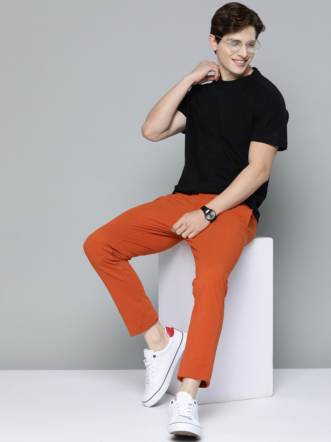 

Mast & Harbour Men Rust Orange Solid Stretchable Regular Trousers