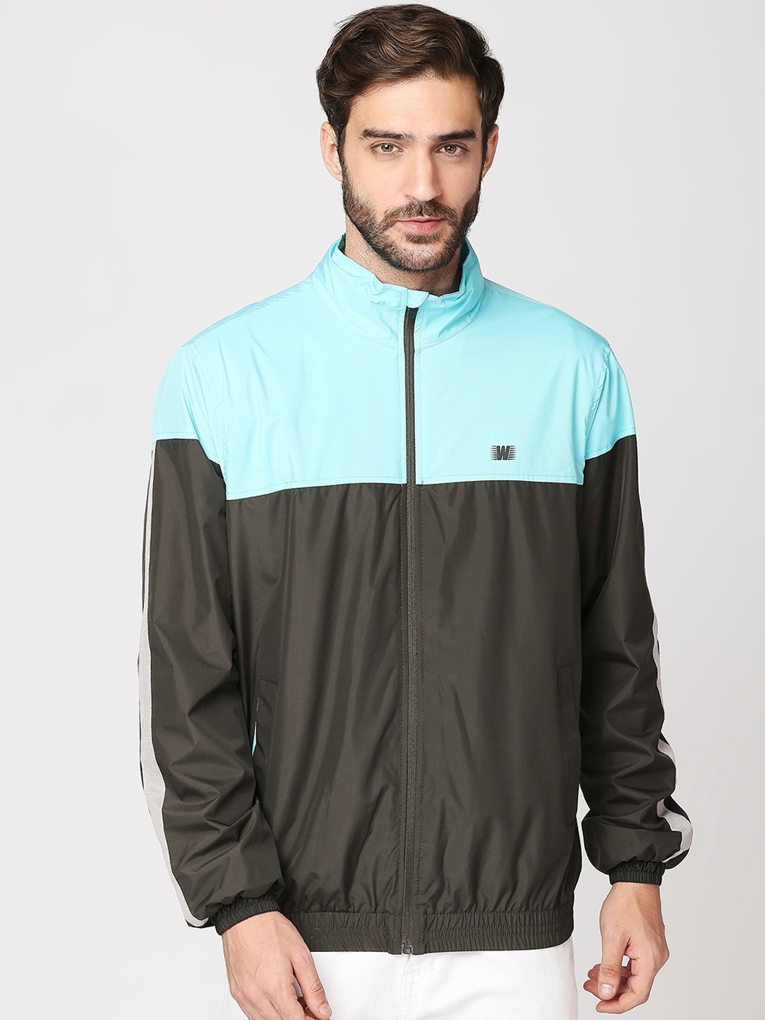 

Zeel Men Olive Green Colourblocked Windcheater Crop Sporty Jacket with Patchwork
