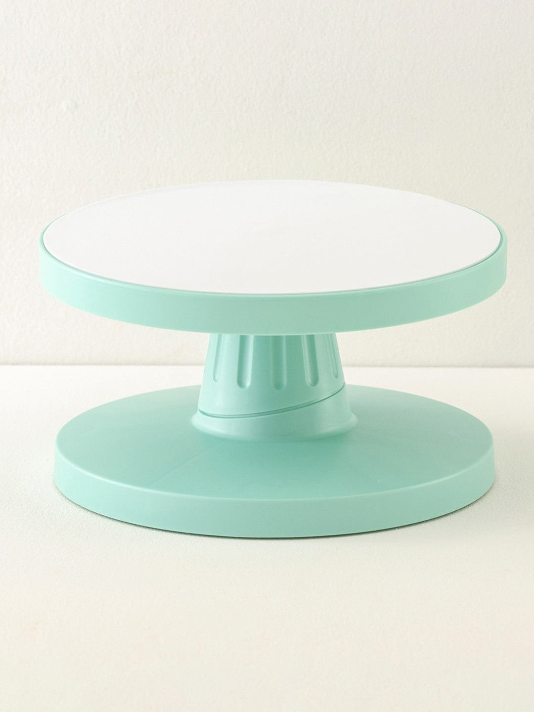 

Home Centre Green Plastic Rotating Cake Stand