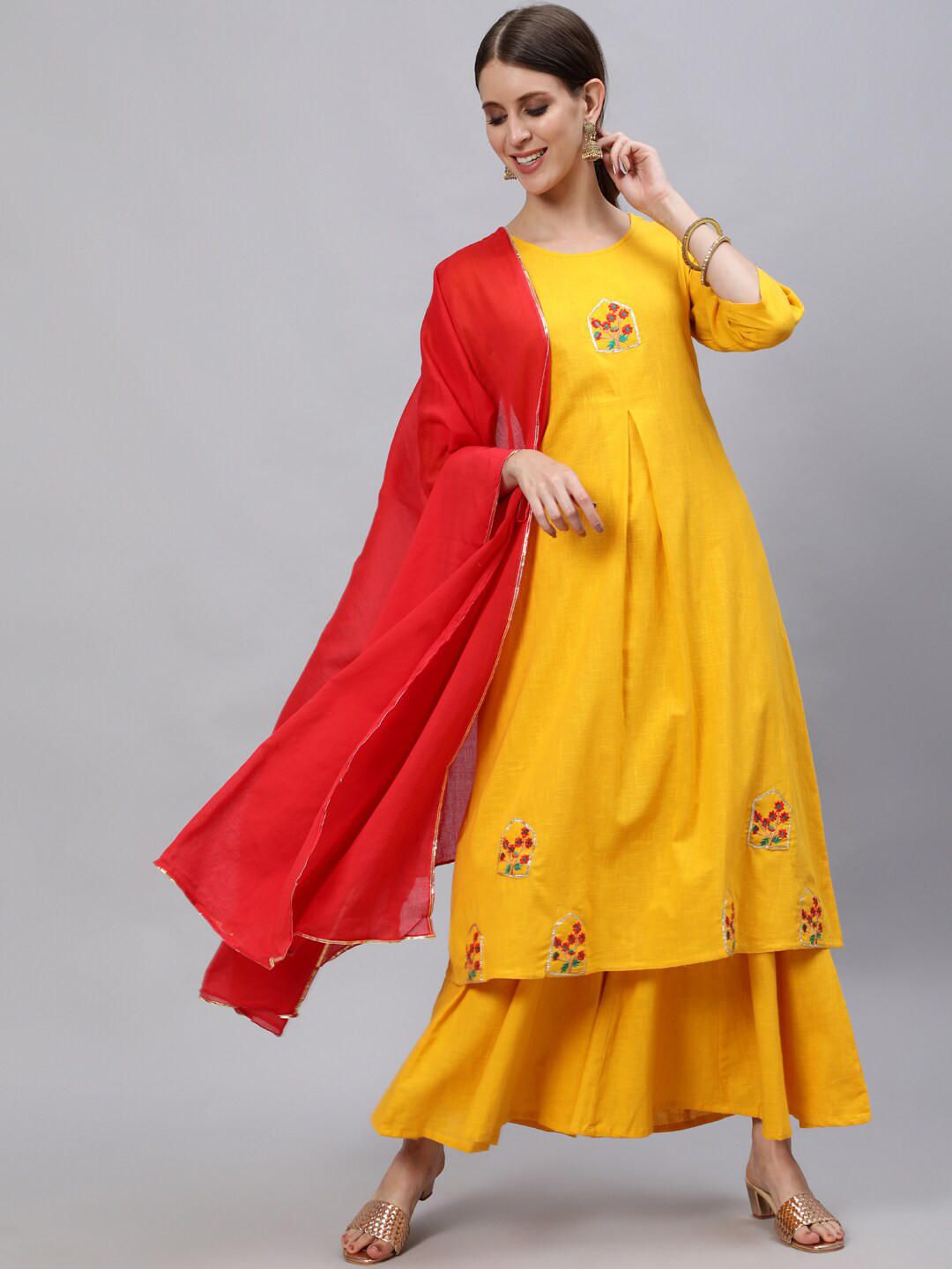 

Jaipur Kurti Women Mustard Yellow Floral Embroidered Empire Kurta with Palazzos & With Dupatta