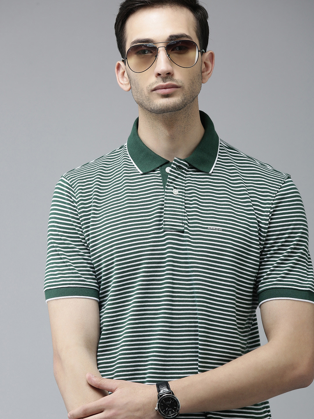 

Arrow Men Dark Green & White Striped Regular Fit Polo Collar Casual T-shirt