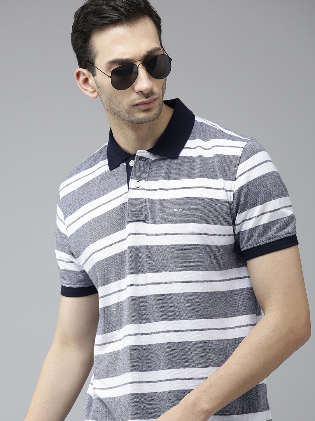 

Arrow Men White & Navy Blue Striped Polo Collar T-shirt