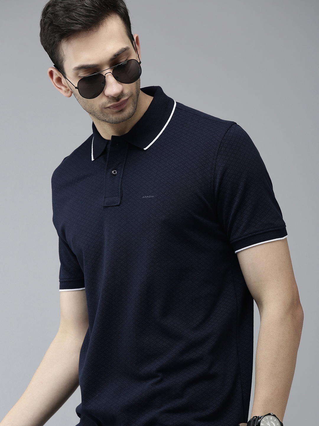 

Arrow Men Navy Blue Solid Pure Cotton Polo Collar T-shirt