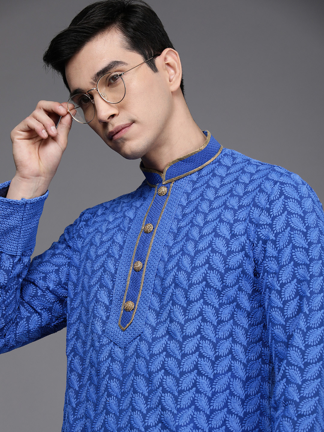 

Manu Men Blue Ethnic Motifs Embroidered Thread Work Kurta with Churidar
