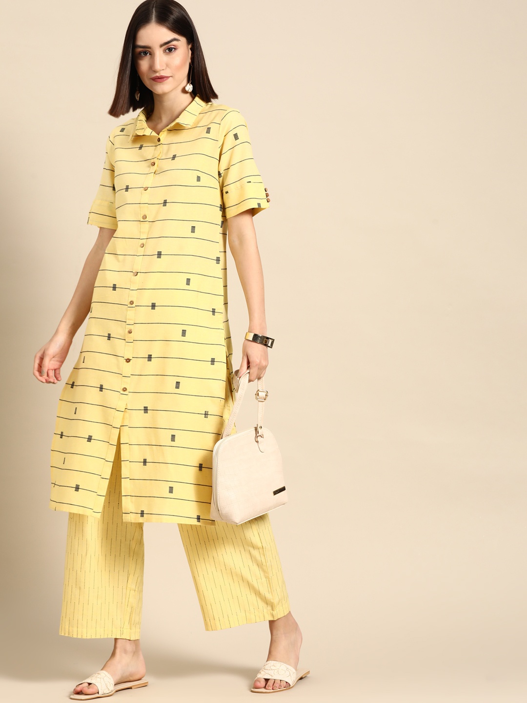 

Anouk Women Yellow Striped Yarn Dyed Kurta with Palazzos