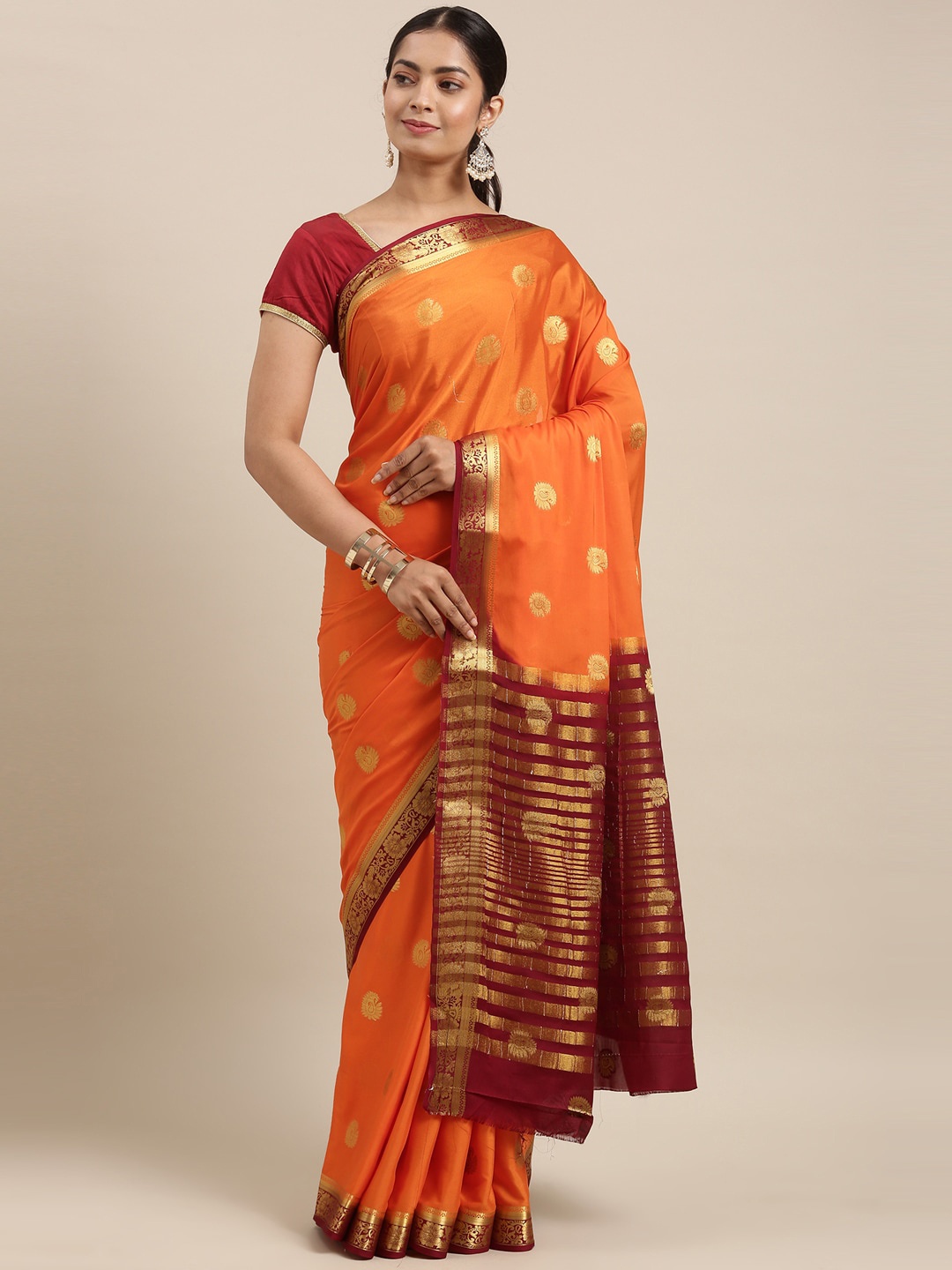 

The Chennai Silks Orange & Gold-Toned Ethnic Motifs Saree