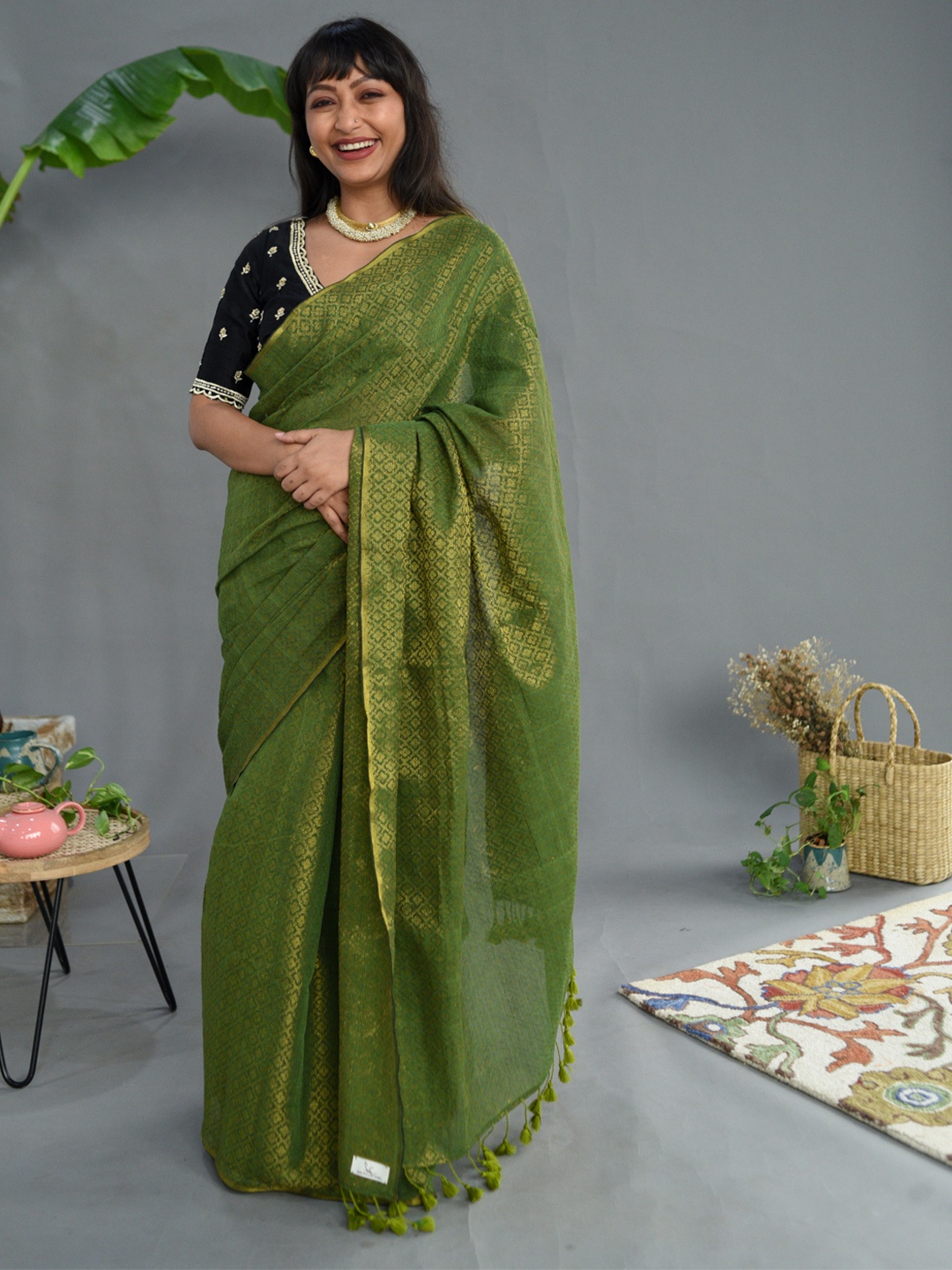 

Suta Olive Green Ethnic Motifs Zari Pure Cotton Saree