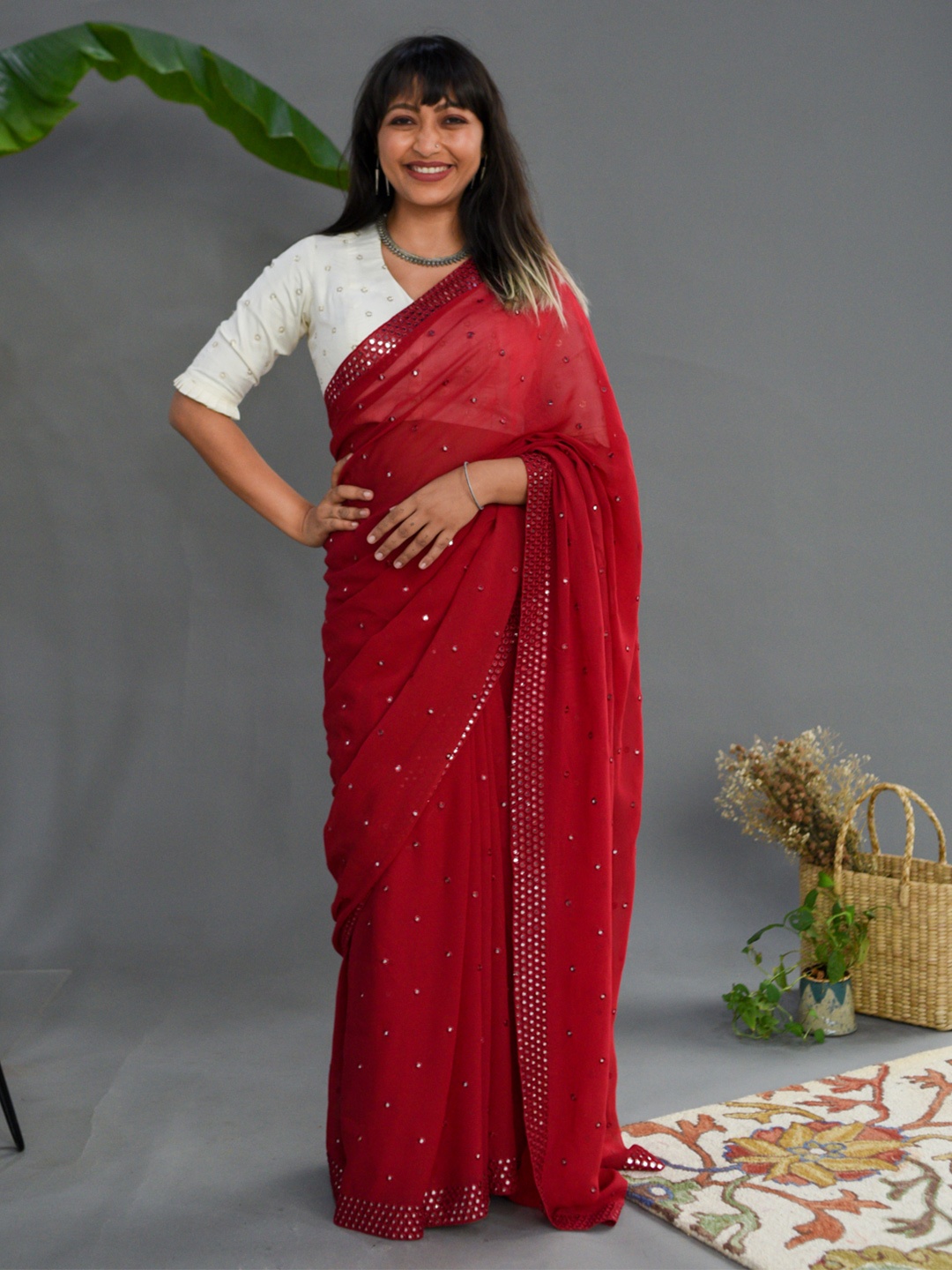 

Suta Maroon Georgette Mirror Work Embellished Saree