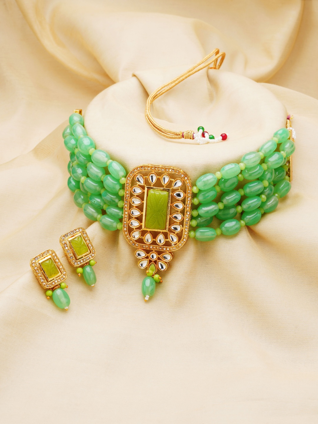 

Zaveri Pearls Gold-Plated Green & White Kundan-Studded & Beaded Jewellery Set