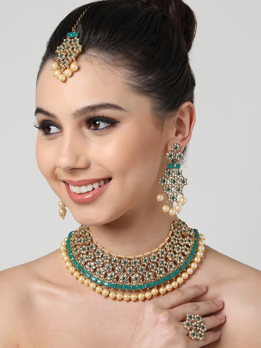 

Zaveri Pearls Gold-Plated Green & White Kundan-Studded & Beaded Jewellery Set