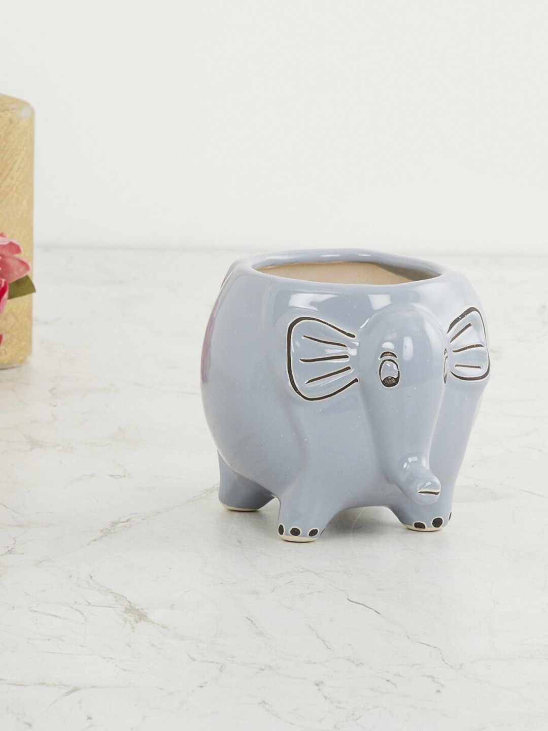 

Home Centre Grey & Brown Malta Ceramic Elephant Shaped Planter
