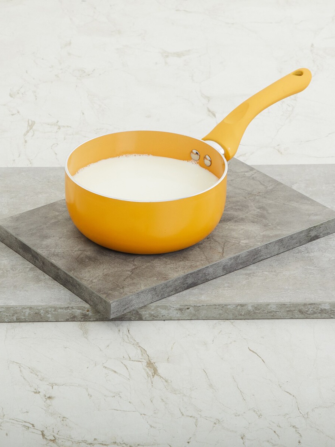 

Home Centre Yellow Solid Aluminium Milk Pan