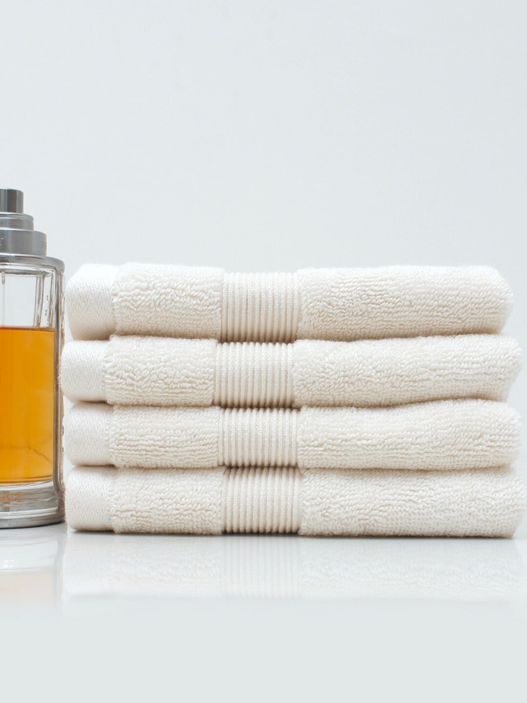 

AVI Living Set of 4 Cream-Coloured Solid 650 GSM Pure Cotton Face Towels