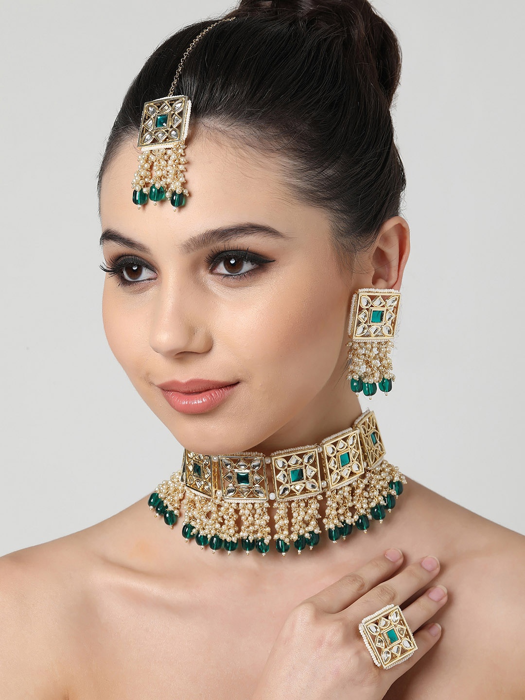 

Zaveri Pearls Gold Plated White & Green Kundan Studded & Green Beaded Jewellery set