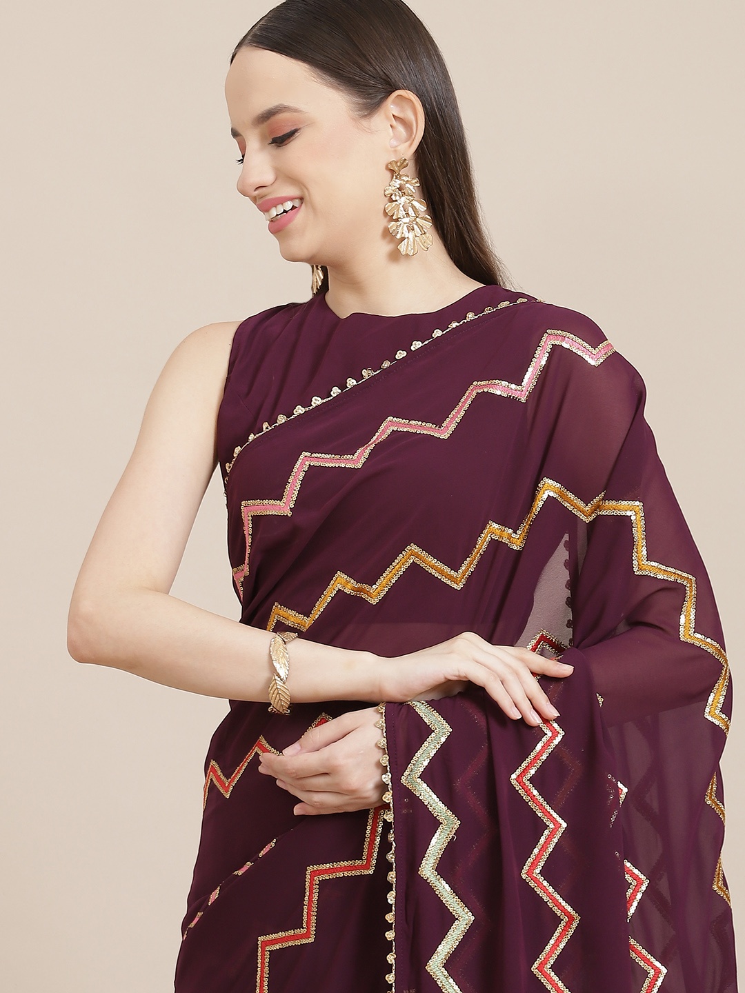 

Inddus Burgundy & Golden Chevron Sequinned Saree