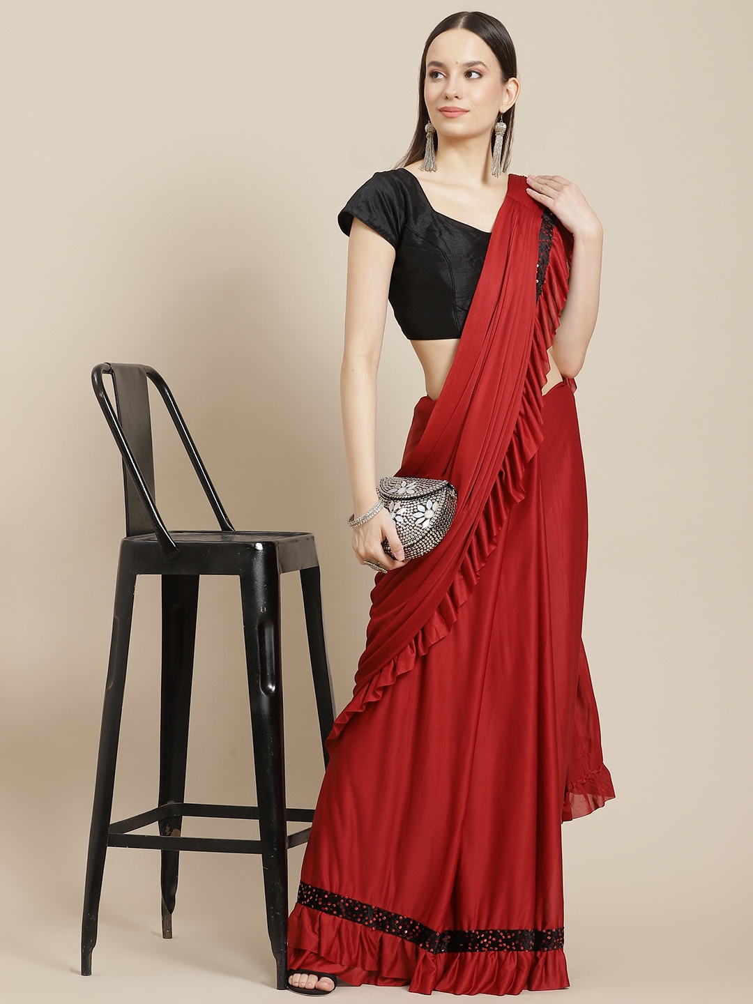 

Anouk Maroon Solid Saree