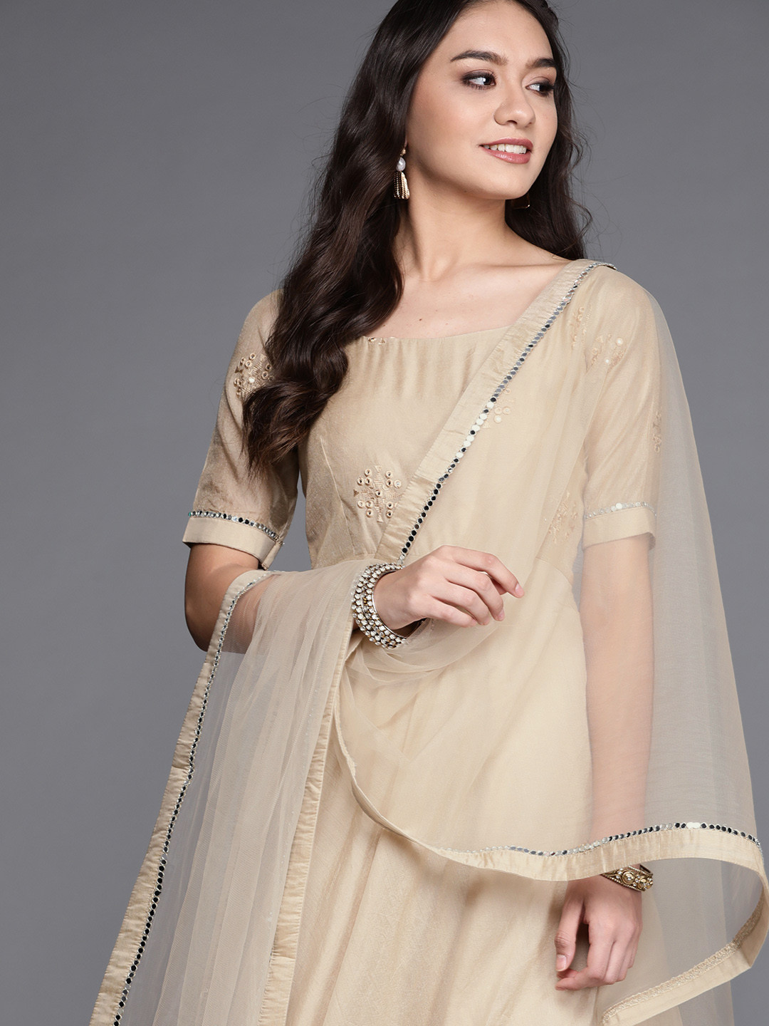 

Inddus Women Beige Ethnic Motifs Yoke Design Mirror Work Anarkali Kurta with Dupatta