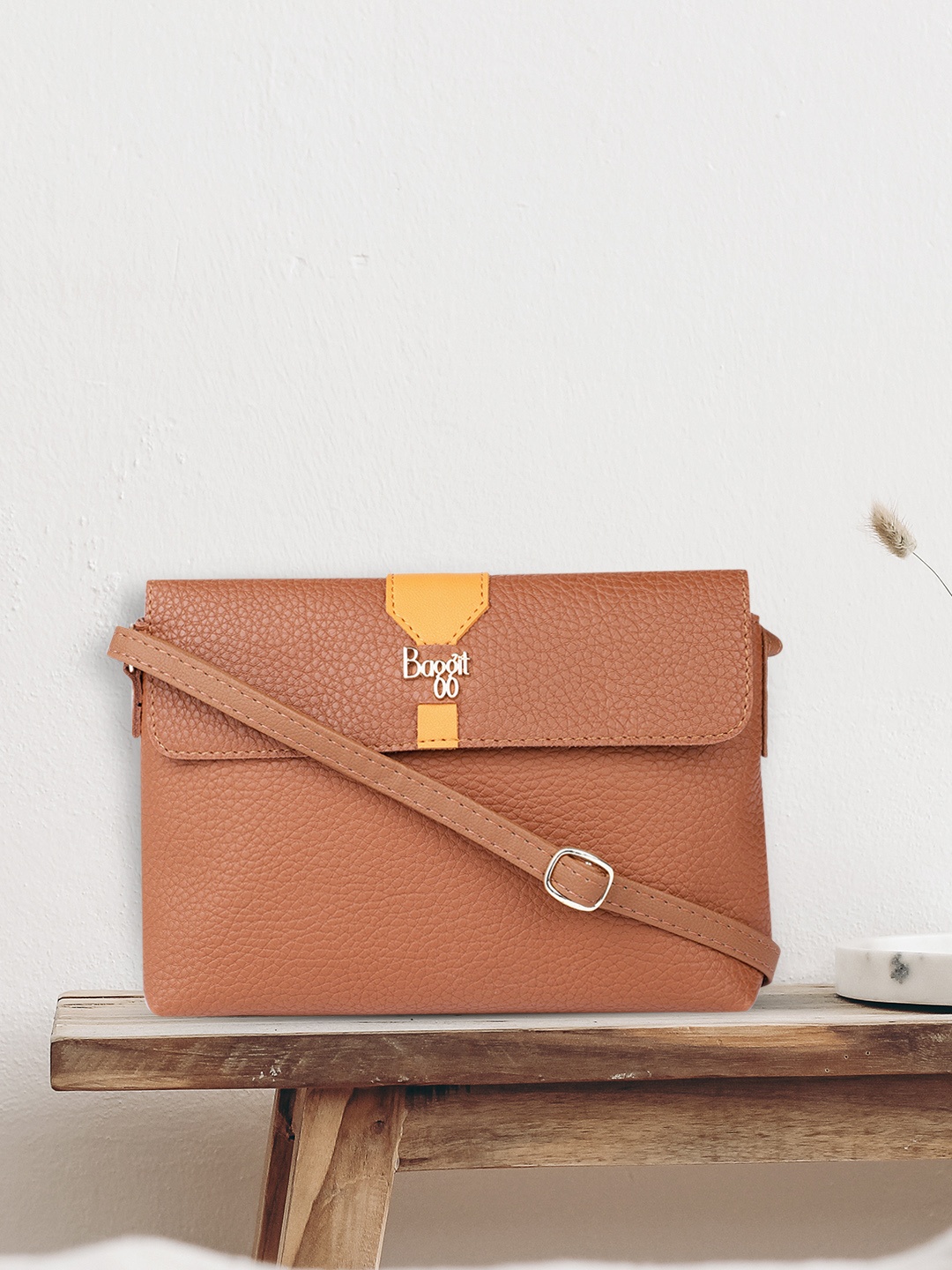 

Baggit Tan Solid Synthetic Synthetic Regular Structured Sling Bag