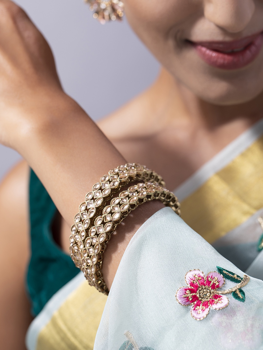 

Anouk Women Set of 2 Gold Plated Kundan Handcrafted Bangles