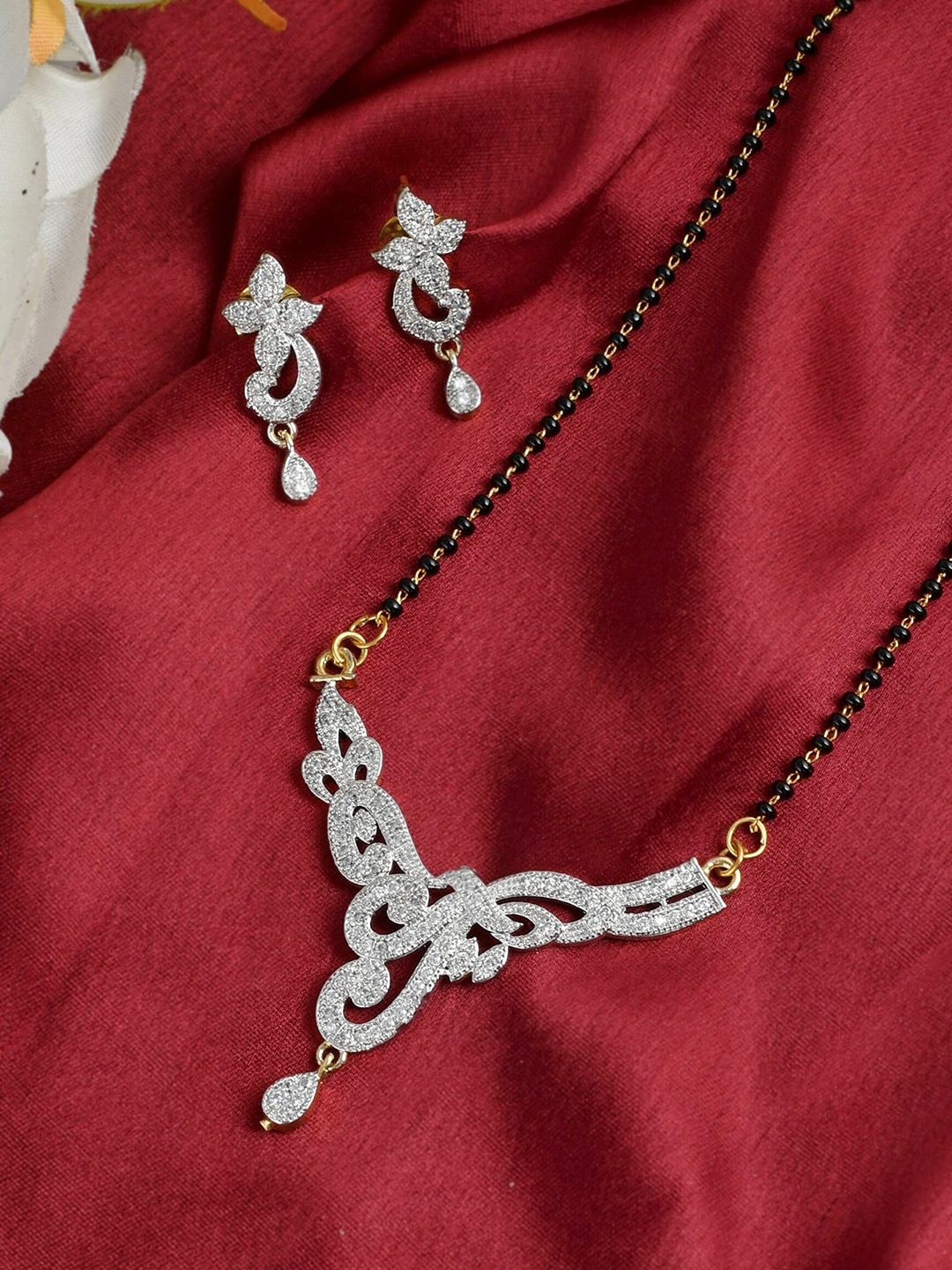 

Silvermerc Designs Women Black & Gold-Toned Harshini Mangalsutra Set