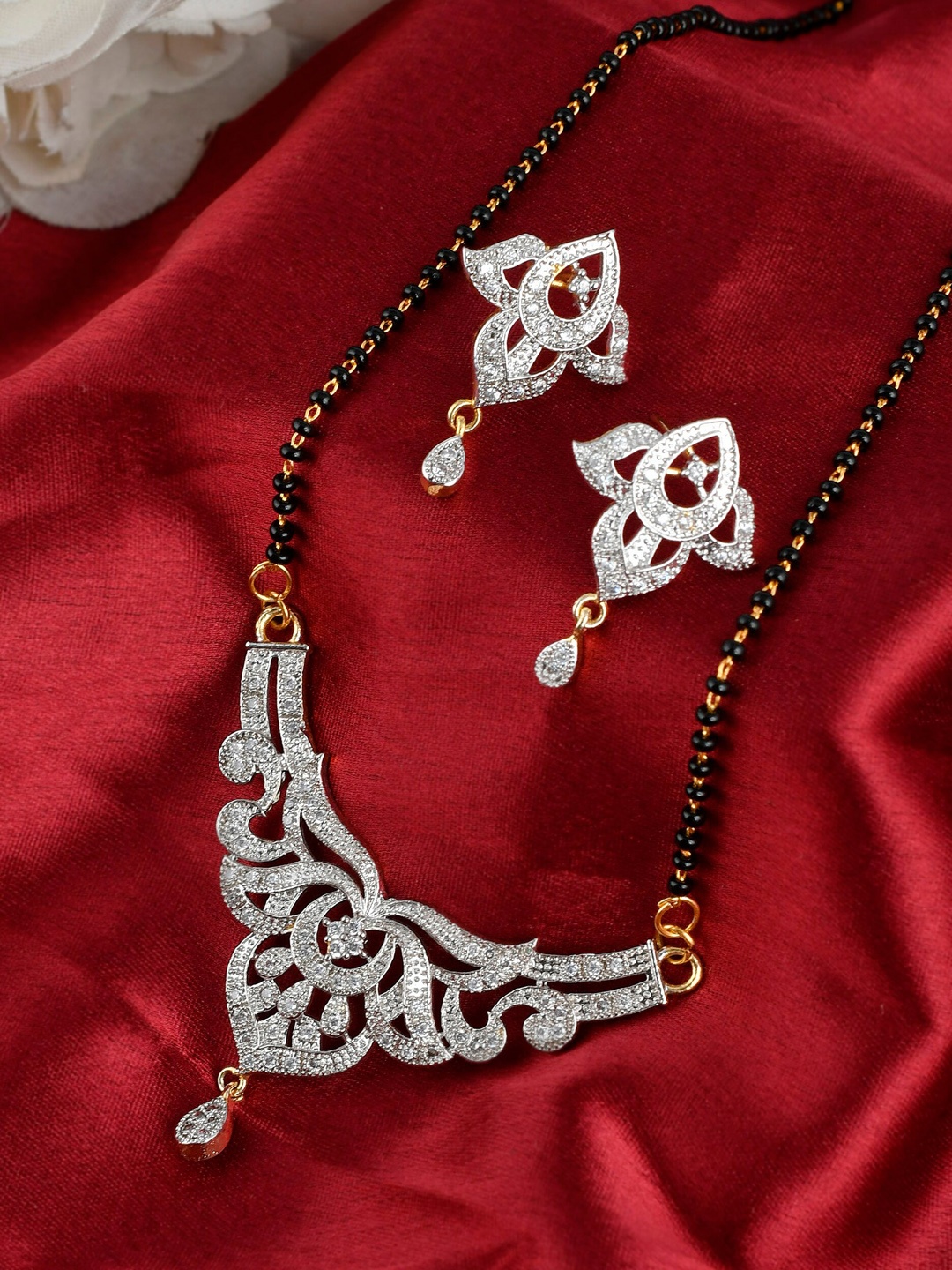 

Silvermerc Designs Women Black & Gold-Toned American Diamond Tanisha Mangalsutra Set