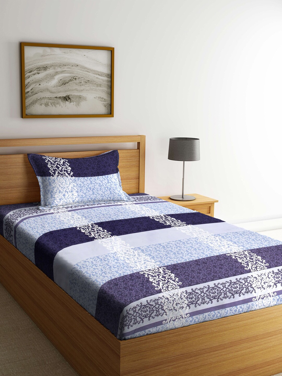 

Arrabi Blue & Lavender Ethnic Motifs Printed 300 TC Single Bedsheet with 1 Pillow Covers
