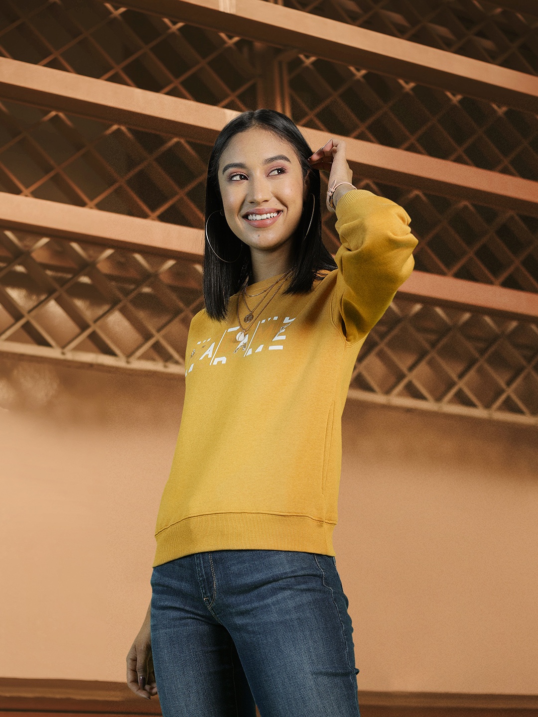 

Madame Women Mustard Yellow Brand Logo Printed Sweatshirt