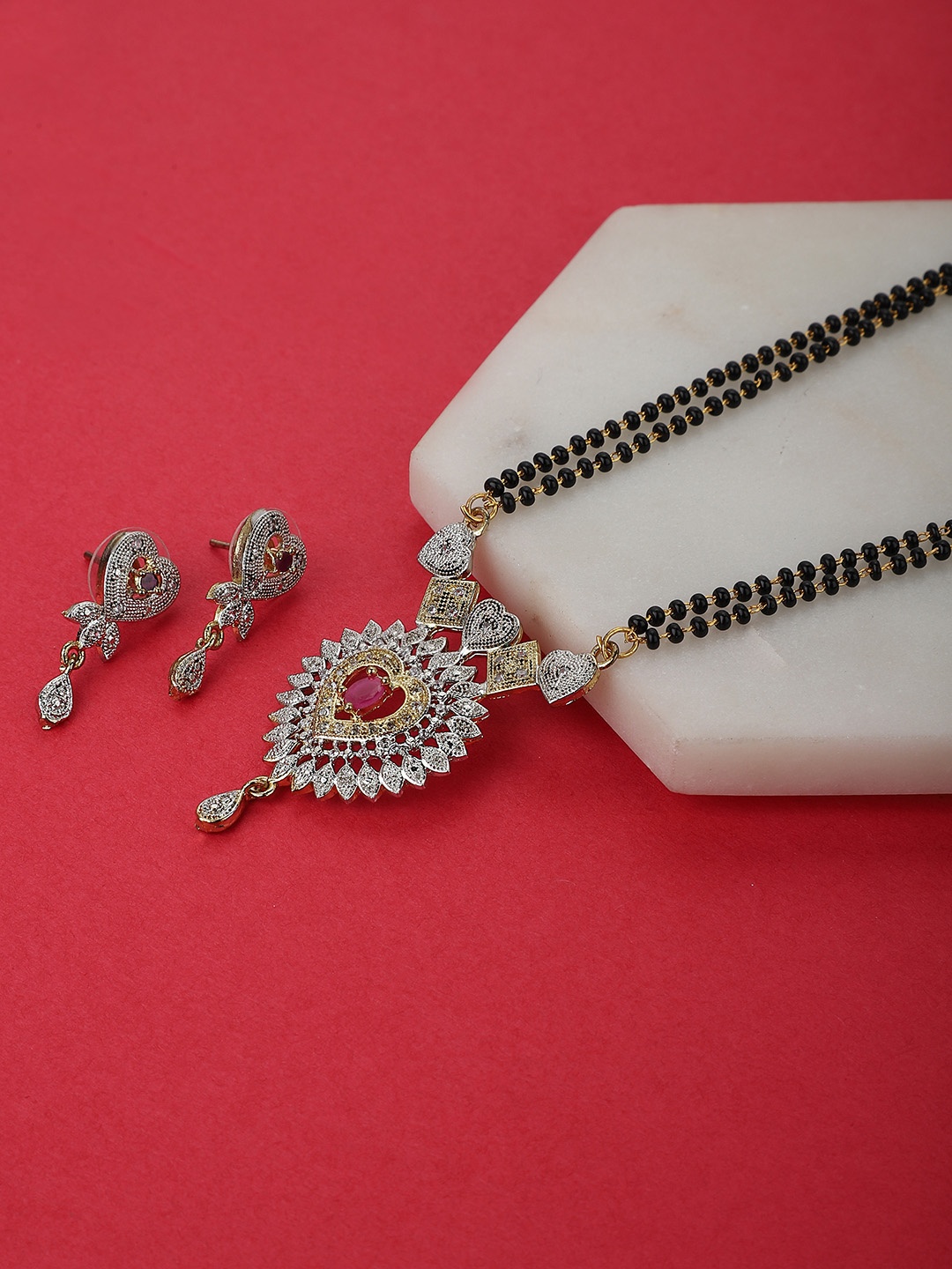 

KOLHA-BY CARLTON Women Black & Gold-Toned & Plated Red Stone & AD-Studded Mangalsutra Set