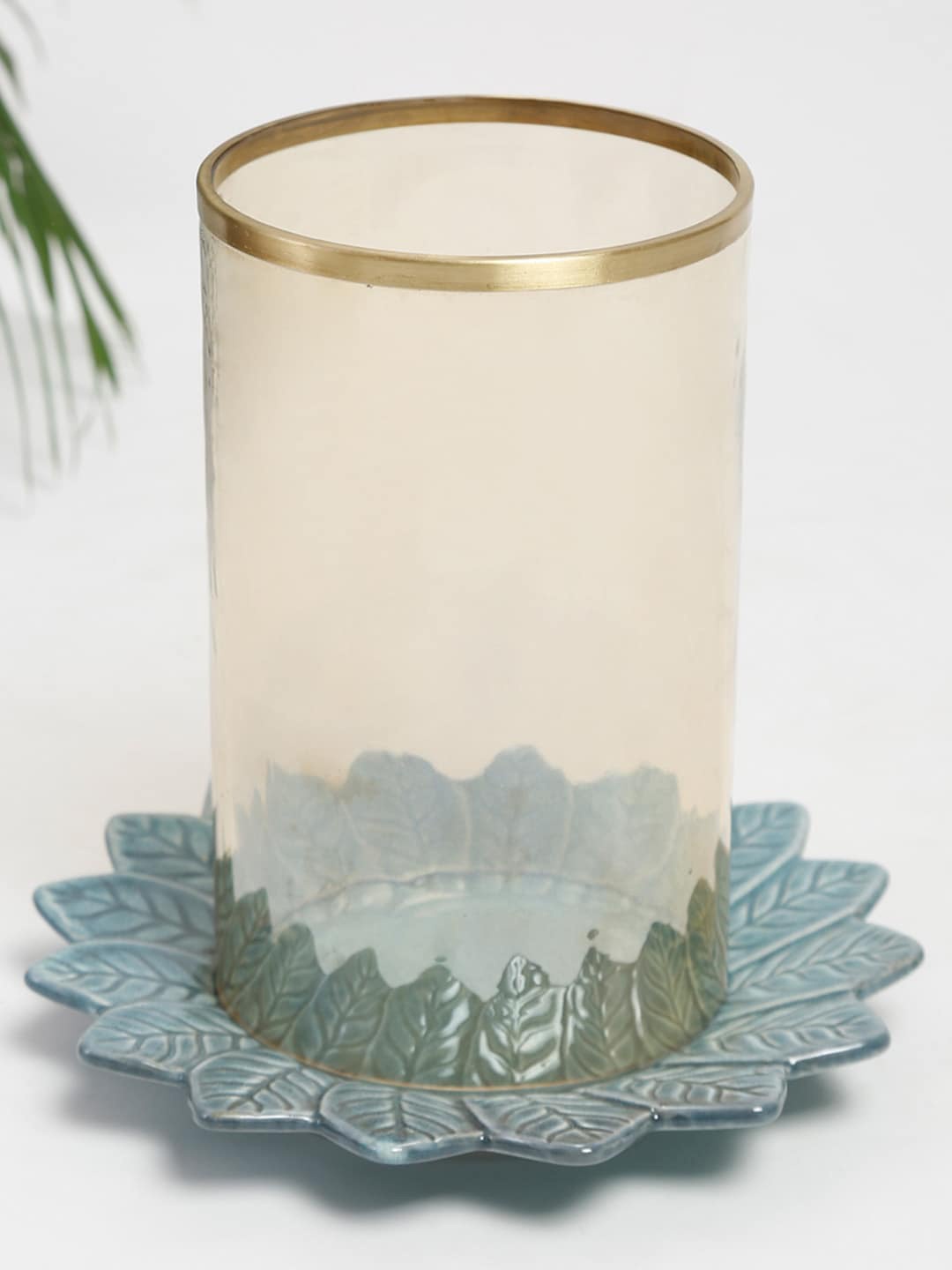 

Fabindia Teal Blue & Transparent Flower Embossed Hurricane Candle Holder