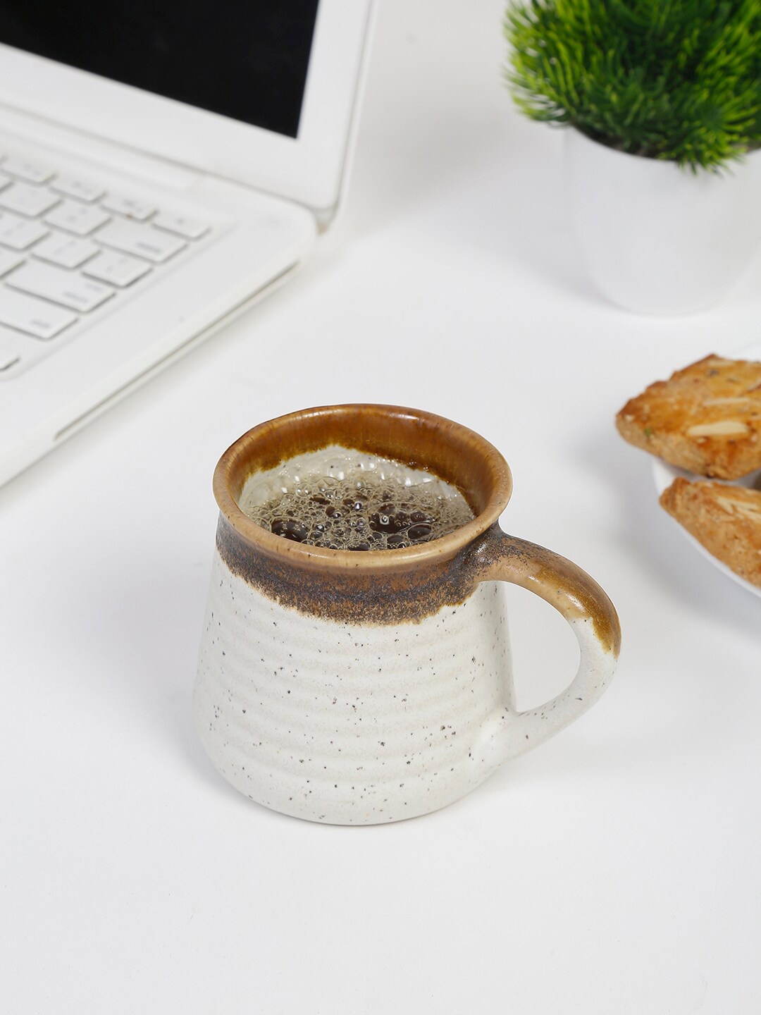 

Fabindia Brown & White Printed Ceramic Glazed Tea Ribbed Matte Mug-170 ml