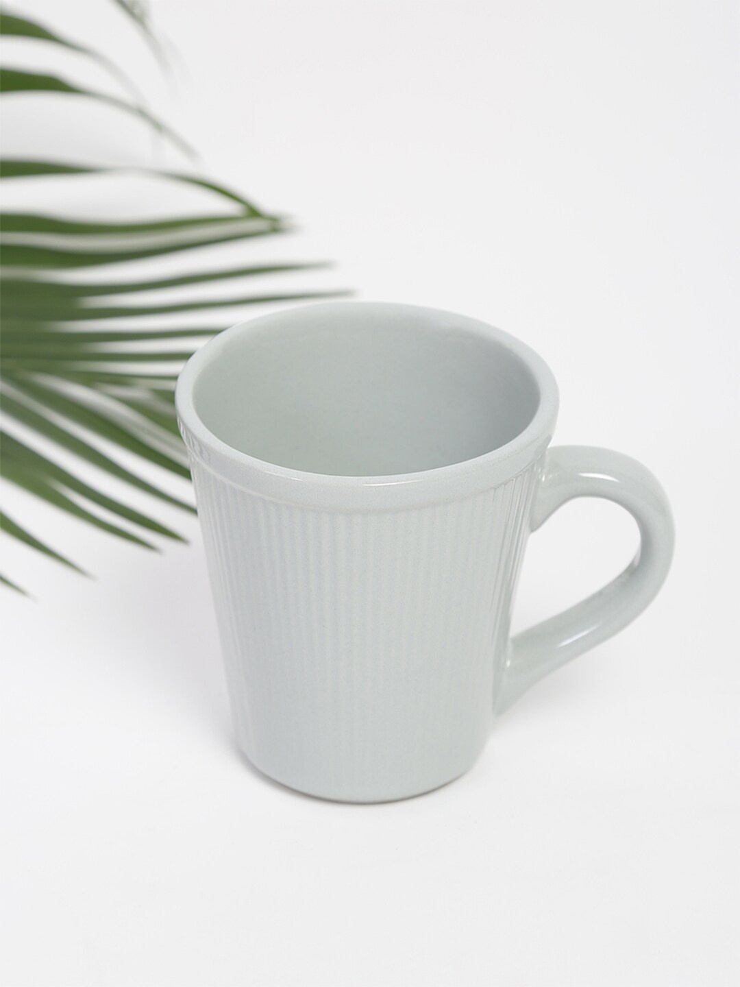 

Fabindia Grey Textured Ceramic Ribbed Coffee Glossy Mug